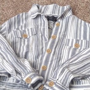 Ranch style blue and white top with tan buttons and pockets